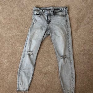 Grey acid wash distressed skinny jeans